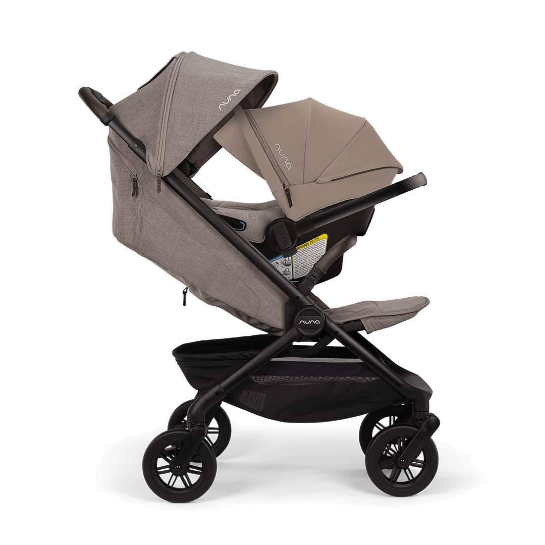 Nuna TRVL 360 lightweight travel stroller and PIPA urbn infant car seat system in Cedar brown, shown in a three-quarters front view against a clean white background.