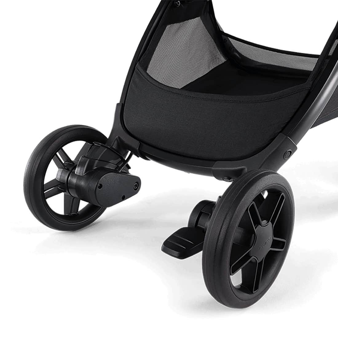 Close-up of a black stroller wheel on a white background