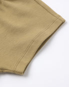 Close-up of beige fabric on a white background