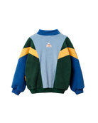 A color-blocked long-sleeve sweatshirt shown from the back, featuring a light blue center panel, dark green side panels, royal blue sleeves and collar, and mustard yellow diagonal stripes across the shoulders. A small triangular logo patch is centered on the back.