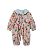 A baby long-sleeve jumpsuit with a light blue ruffled collar, featuring a dense floral print in red, navy blue, and yellow on a cream background.