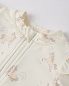 Baby outfit with unicorn pattern on a light background