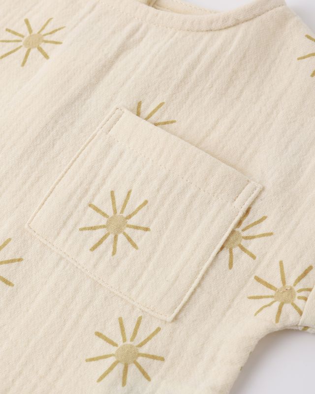 Beige fabric with gold star patterns on a white background