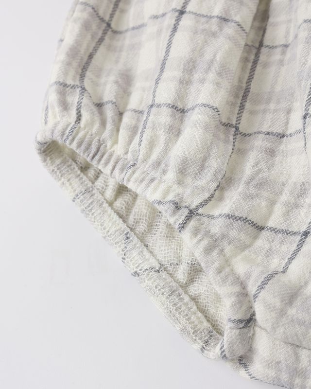 Textured fabric with a grid pattern on a light background