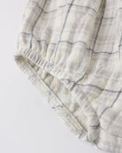 Textured fabric with a grid pattern on a light background