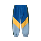 Colorblock fleece jogger pants in blue, yellow, and light blue with dark green side panels, shown on a plain white background.