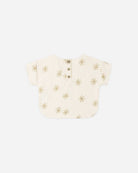 Baby romper with gold star pattern on a white background