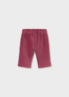 A pair of toddler's corduroy shorts in a dusty rose or mauve color, featuring an elastic waistband, shown flat on a light gray background.