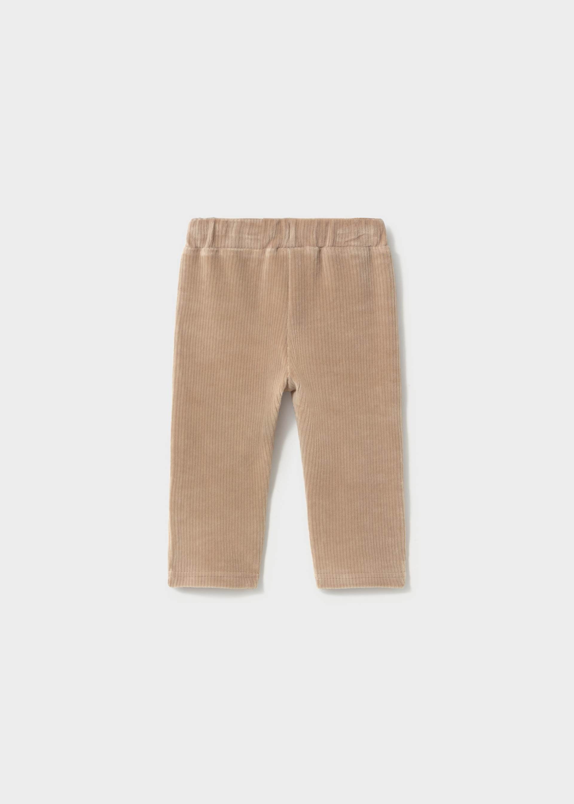 Beige corduroy pants on a white background