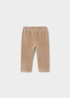 Beige corduroy pants on a white background