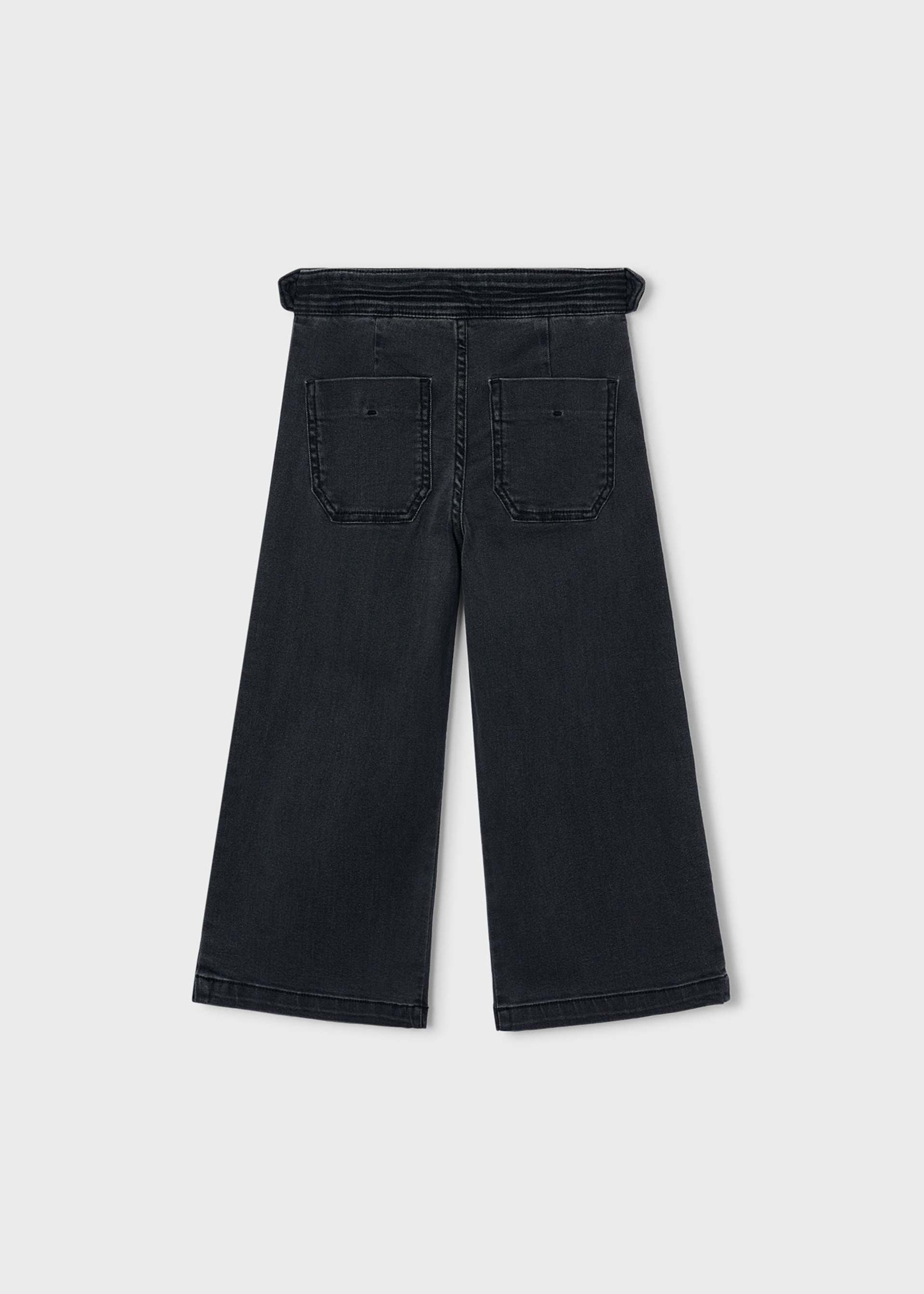 Black wide-leg cropped jeans shown from the back, featuring a drawstring waistband and two back patch pockets, on a light gray background.