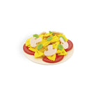 Model pizza with yellow cheese, red sauce, and green leaves on a white background