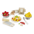 Playset with pasta, vegetables, and utensils on a white background
