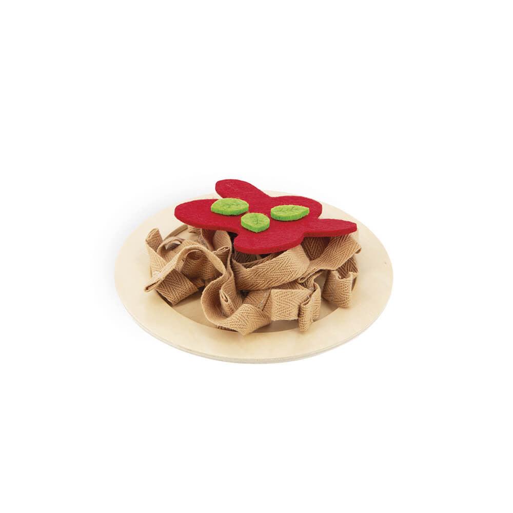 Toy with a red flower and green buttons on a beige base against a white background