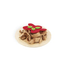 Toy with a red flower and green buttons on a beige base against a white background