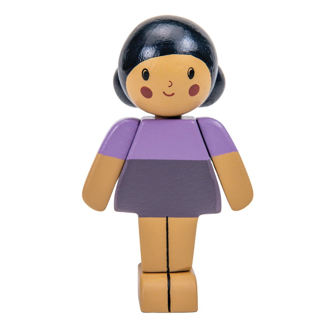 A wooden toy doll with a stylized face, black hair, a purple top, and a dark gray skirt, shown against a plain white background.