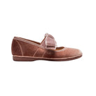 Pink velvet shoe with a bow on a white background