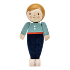 Wooden toy figure of a person with a blue shirt and dark pants on a white background