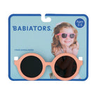 Babiators sunglasses packaging with a child model and product display.