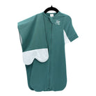 A seafoam green swaddle sack with white butterfly wings and a mesh laundry bag, displayed against a white background.