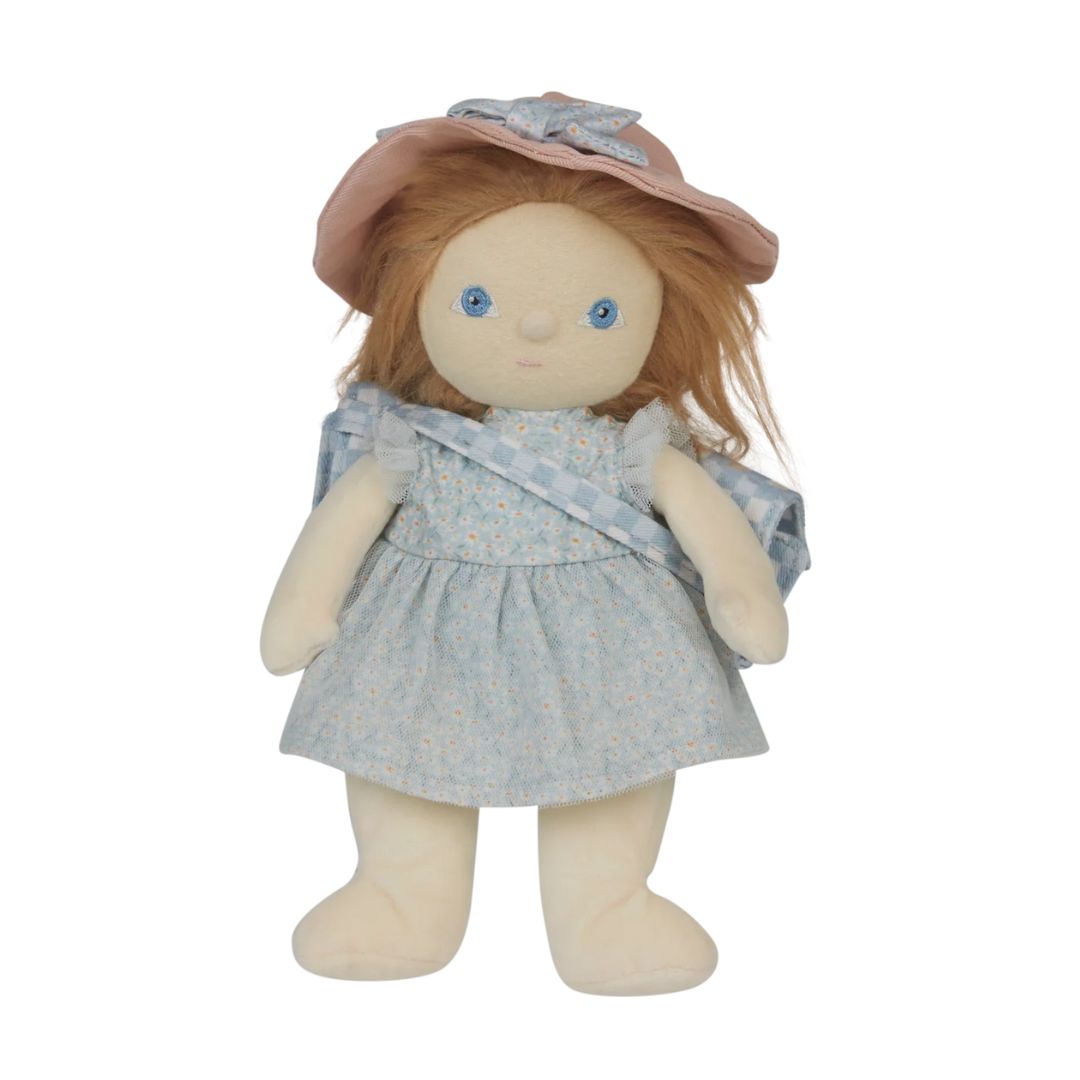 A vintage-style plush doll with long red hair, wearing a light blue floral dress, a matching blue ribbon, and a dusty pink bonnet with a blue bow, set against a plain white background.