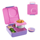Pink and purple bento box with compartments filled with food, omie logo visible.