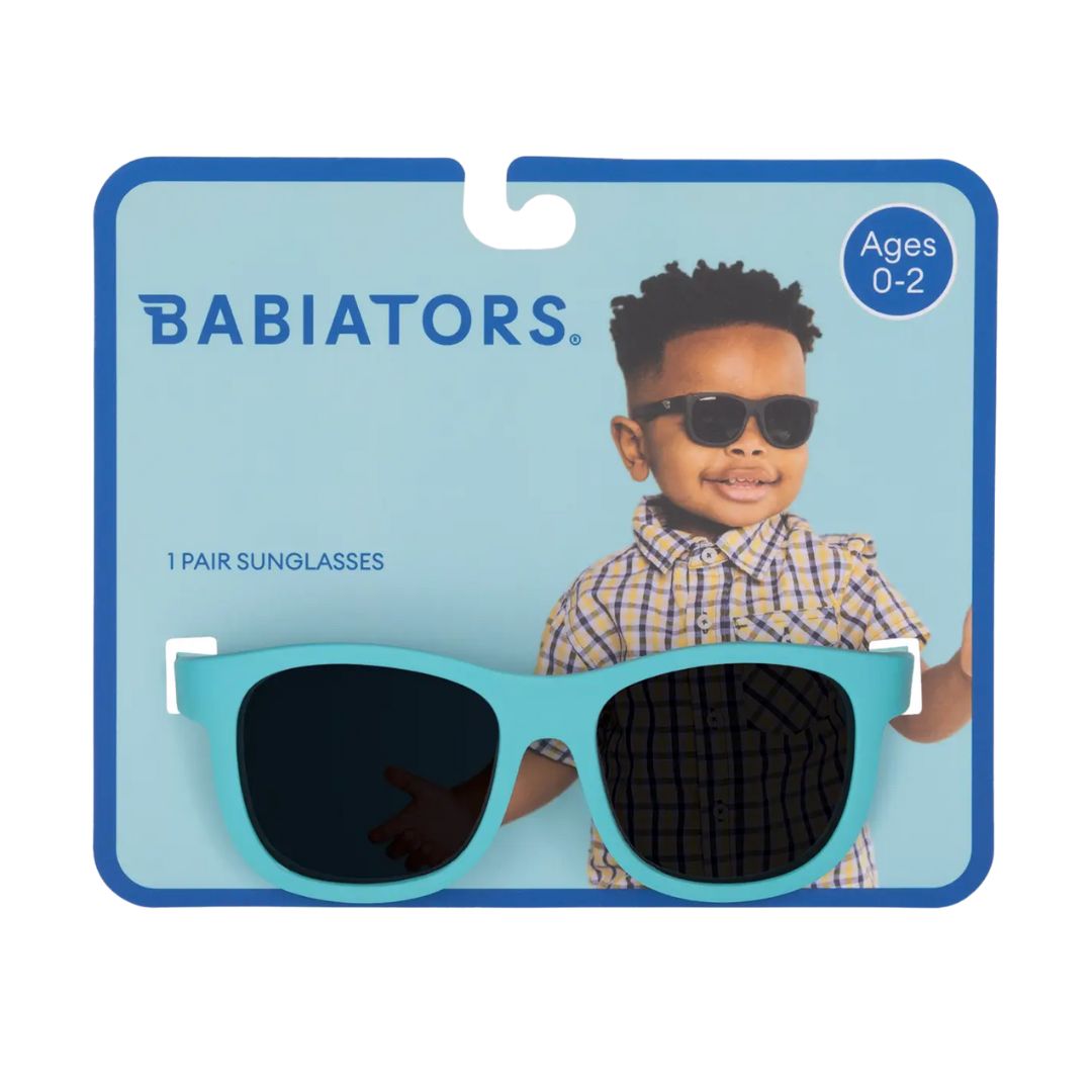 Babiators sunglasses packaging with a child model and product display