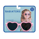 Babiators heart-shaped sunglasses packaging with a child model on a blue background