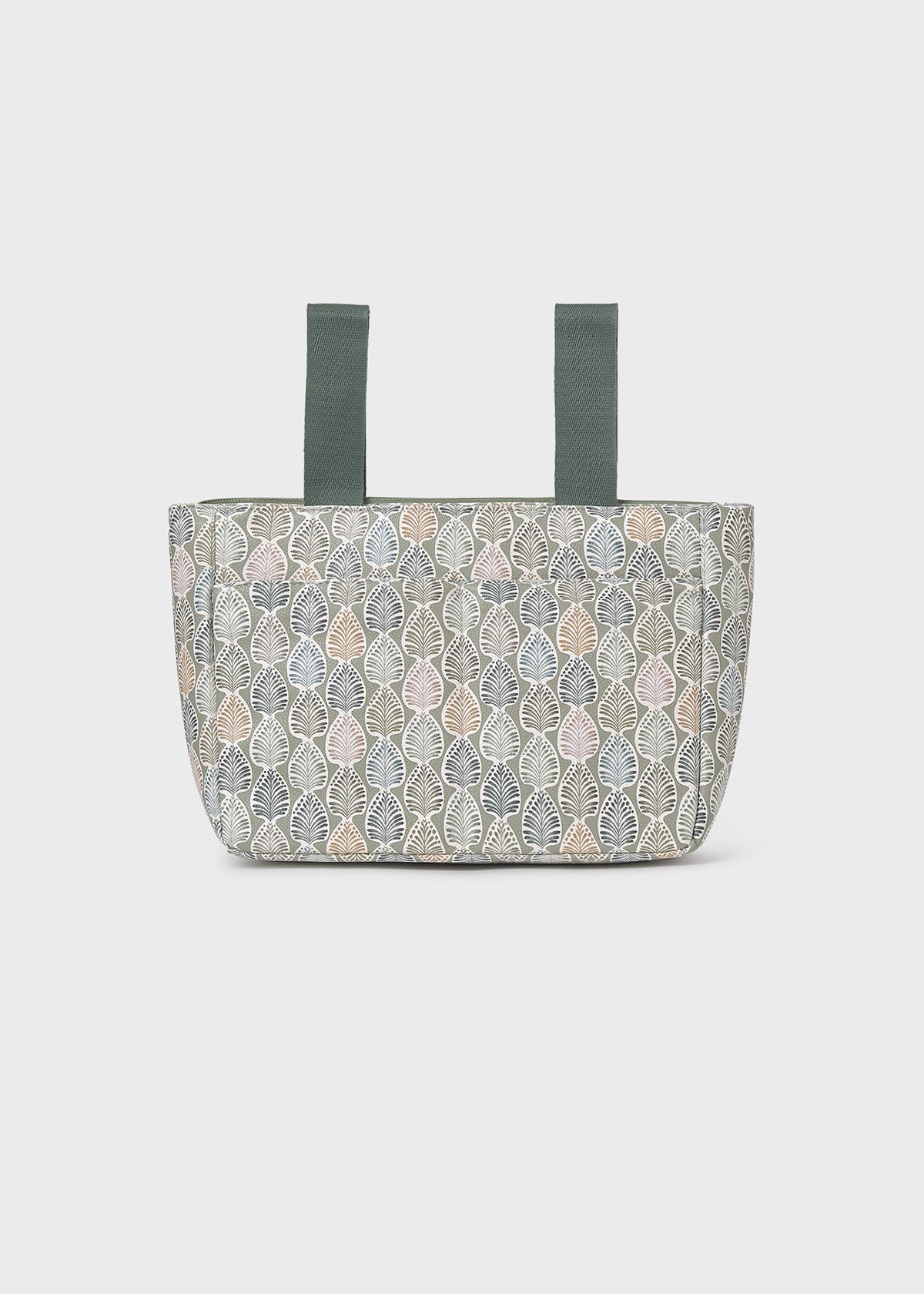 Patterned tote bag with green straps on a white background