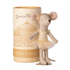 Stuffed mouse toy in a tutu dress next to a cylindrical packaging with 'Dance Th Romeo & Juliet' text.