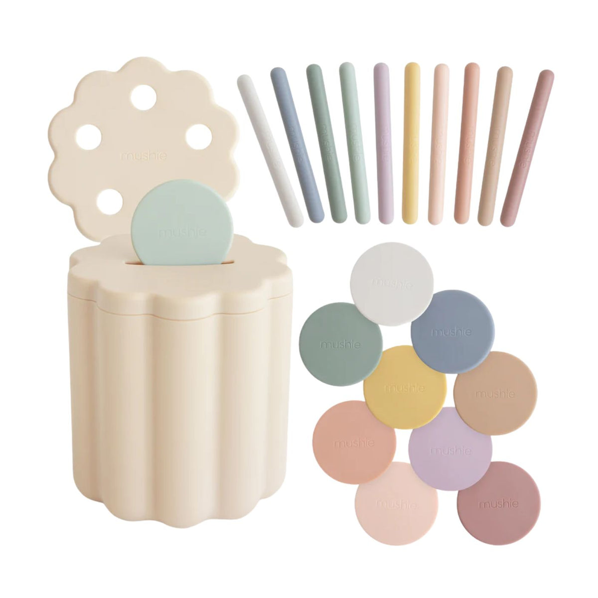 Set of pastel-colored chalks and a container on a white background