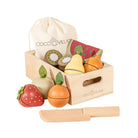 Coco Village wooden toy fruit crate set with a natural wood box, assorted painted fruit pieces, a cream drawstring bag, and a wooden knife on a white background.