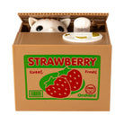Toy cat popping out of a cardboard box labeled 'Strawberry Orchard' on a white background