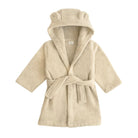 A cream-colored plush bathrobe with a hood featuring bear ears, shown against a plain white background.