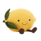 Plush lemon toy with a smiley face on a white background