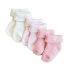 Set of baby socks in white and pink on a white background