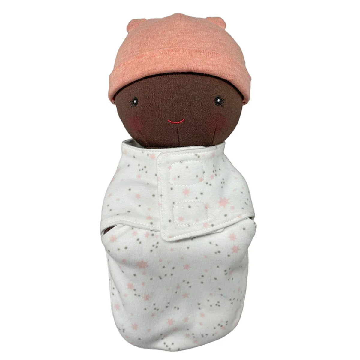 Stuffed toy wrapped in a blanket with a pink hat on a white background