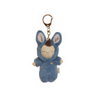A plush keychain featuring a sleeping blue bunny character with a gold metal keyring and clasp, shown against a plain white background.