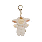 A plush sheep keychain charm with a sleeping face, pink inner ears, and a small rainbow detail on its chest, attached to a gold metal key ring, shown on a plain white background.