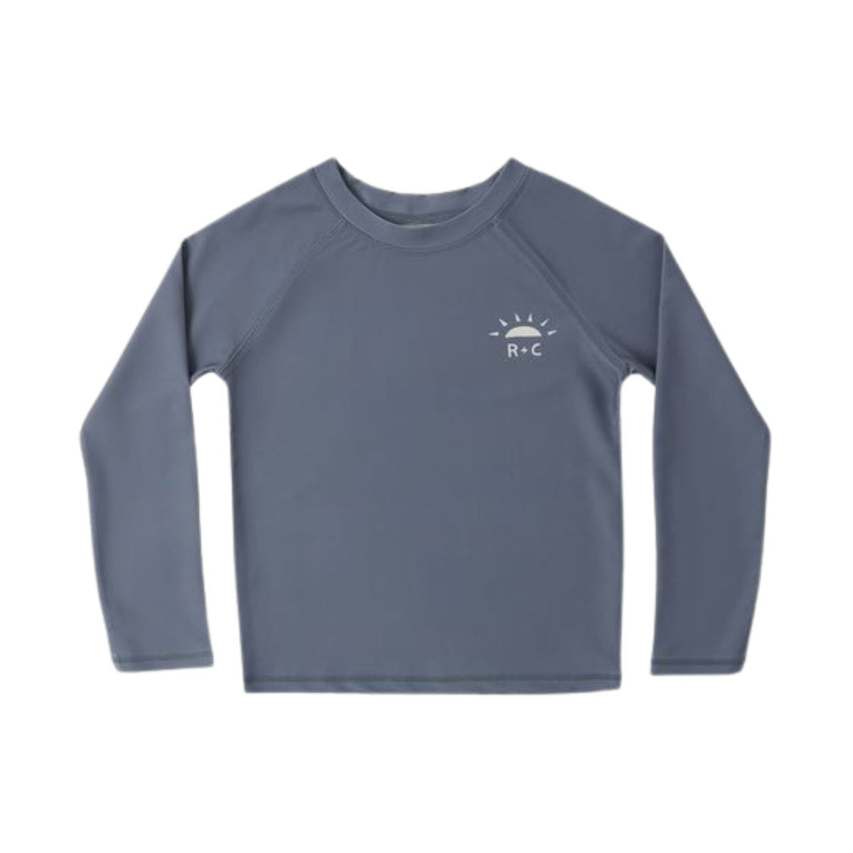 A kids' long-sleeve rash guard in slate blue with a small white 'B+C' sun logo on the left chest, displayed flat against a solid white background.