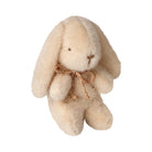 Plush bunny toy with a brown bow on a white background