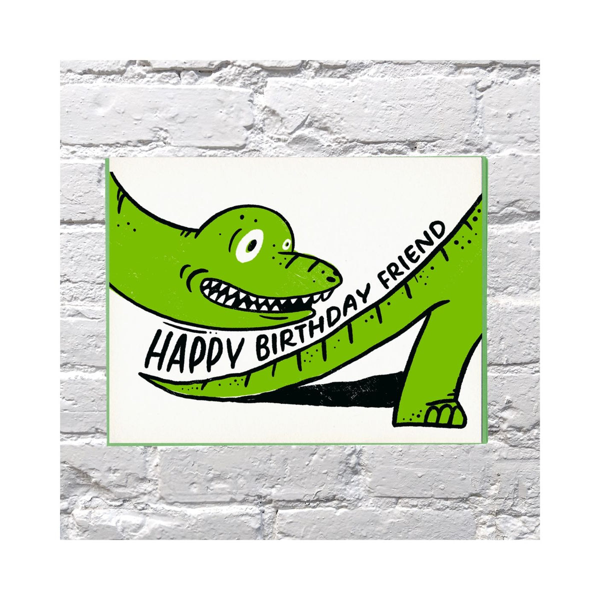 Green dinosaur with 'Happy Birthday Friend' banner on a white background