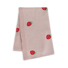 Beige blanket with strawberry patterns on a white background