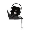 Black baby car seat with base on a white background