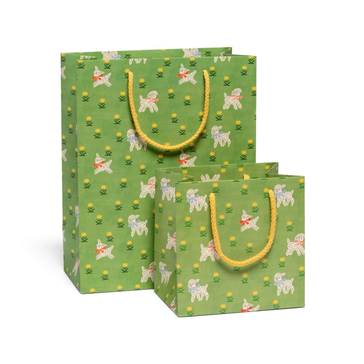 Two green paper gift bags with a repeating pattern of white dogs, yellow flowers, and small red hearts, featuring yellow rope handles, shown on a white background.