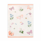 Floral and butterfly patterned towel on a white background