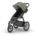 Green and black stroller on a white background