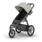 Gray and black stroller on a white background