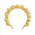 Yellow headband with floral pattern on a white background