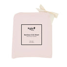 Pink bamboo crib sheet with Kyte Baby label on a white background